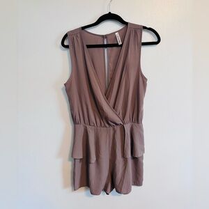 Peppermint dusty purple romper with ruffles at the hips and deep v in